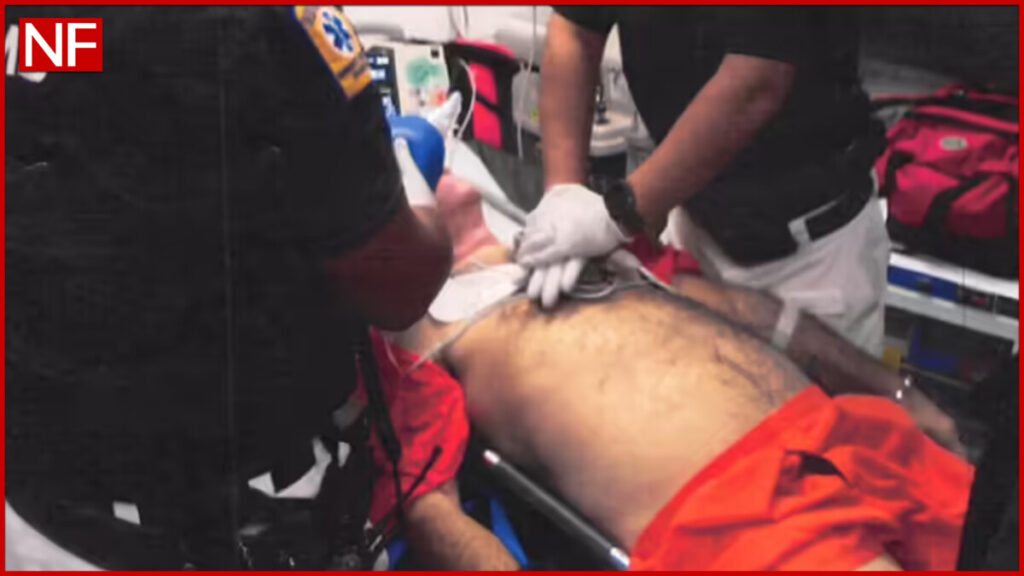 Emergency responders treating unresponsive inmate (Department of Justice)