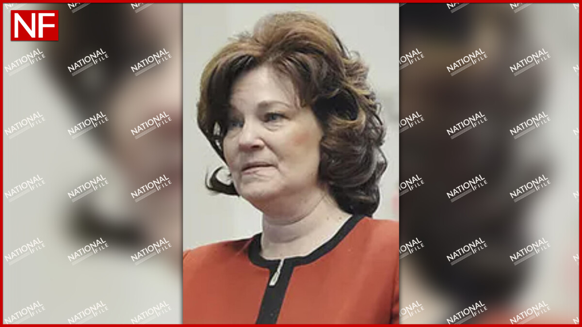 Portrait of Judge Laura Faircloth wearing a red jacket with black trim, shown from the shoulders up against a neutral background, with a National File watermark pattern over the image.
Wet & Wild In West Virginia. Taylor Staubs